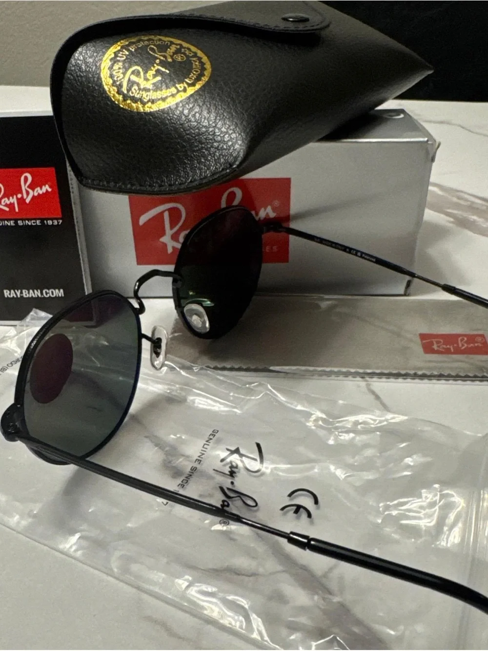 Ray-Ban Black Frame Sunglasses with Green Polarized Lenses